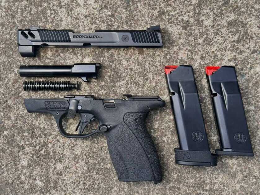 Field stripped S&W Bodyguard 2.0 Carry Comp showing ported barrel and slide internals