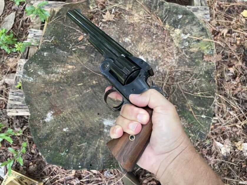 Cimarron American revolver in hand showing vertical grip similar to Colt Bisley