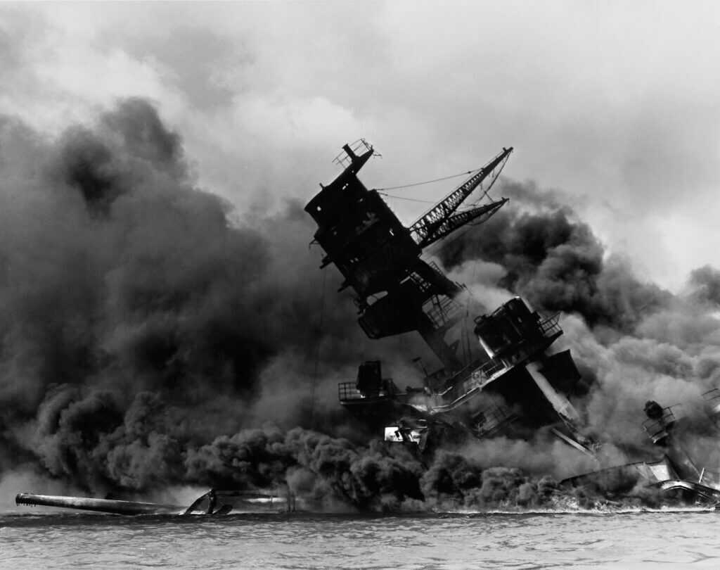 USS Arizona burning at Pearl Harbor during World War 2 attack