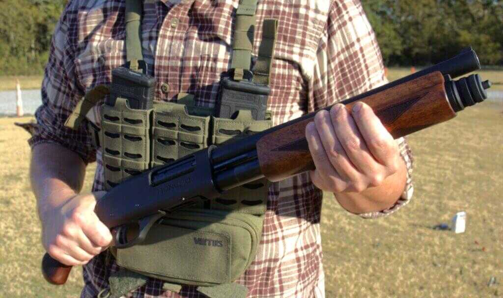 Charles Daly Honcho 12-gauge pistol-grip shotgun held in hand during review