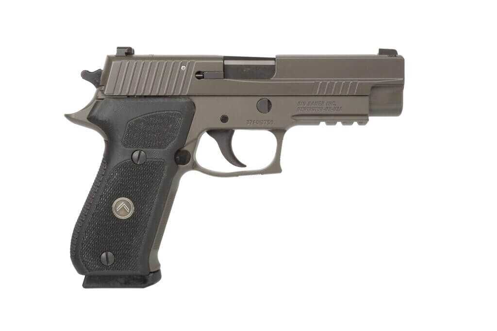 Side view of SIG Sauer P220 .45 ACP pistol with serrated slide and ergonomic grip