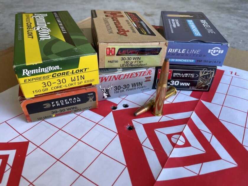 Assorted .30 30 Winchester ammunition options next to Model 94
