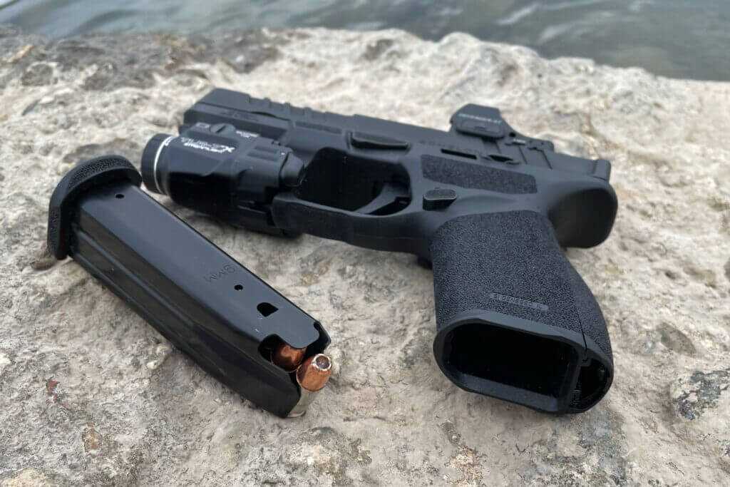 Echelon 4.0C magwell detail showing chamfer aiding faster reloads on river rock