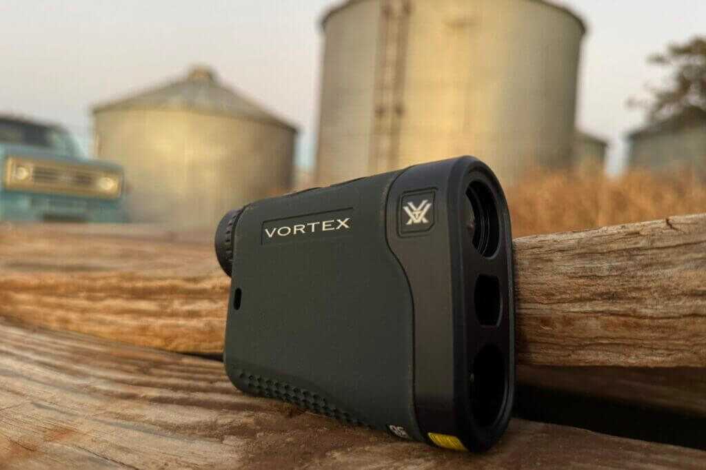 Vortex Triumph HD 850 compact laser rangefinder shown in hand for scale