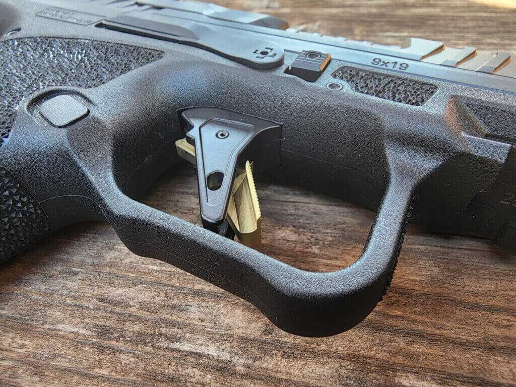 close up pistol trigger used handgun inspection trigger reset check