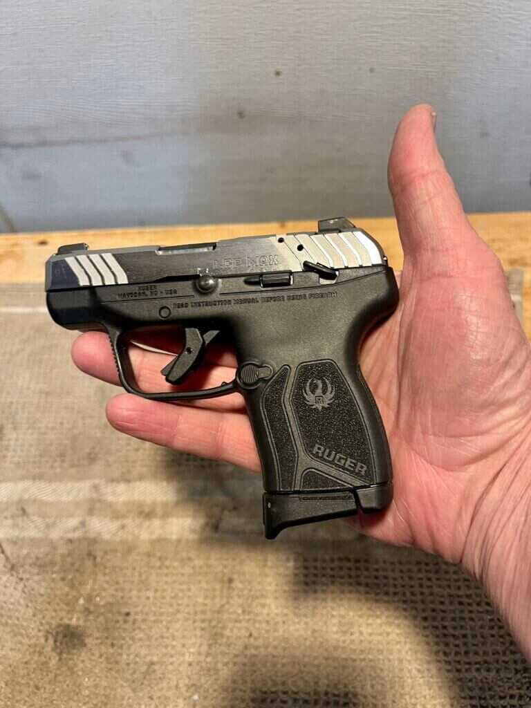 Ruger LCP Max in hand showing how small the .380 pocket pistol is for concealed carry