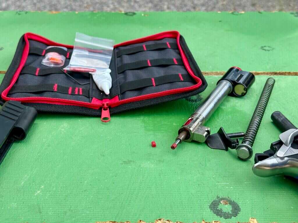 Close-up of CoolFire Trainer Striker Tip wear next to new replacement insert