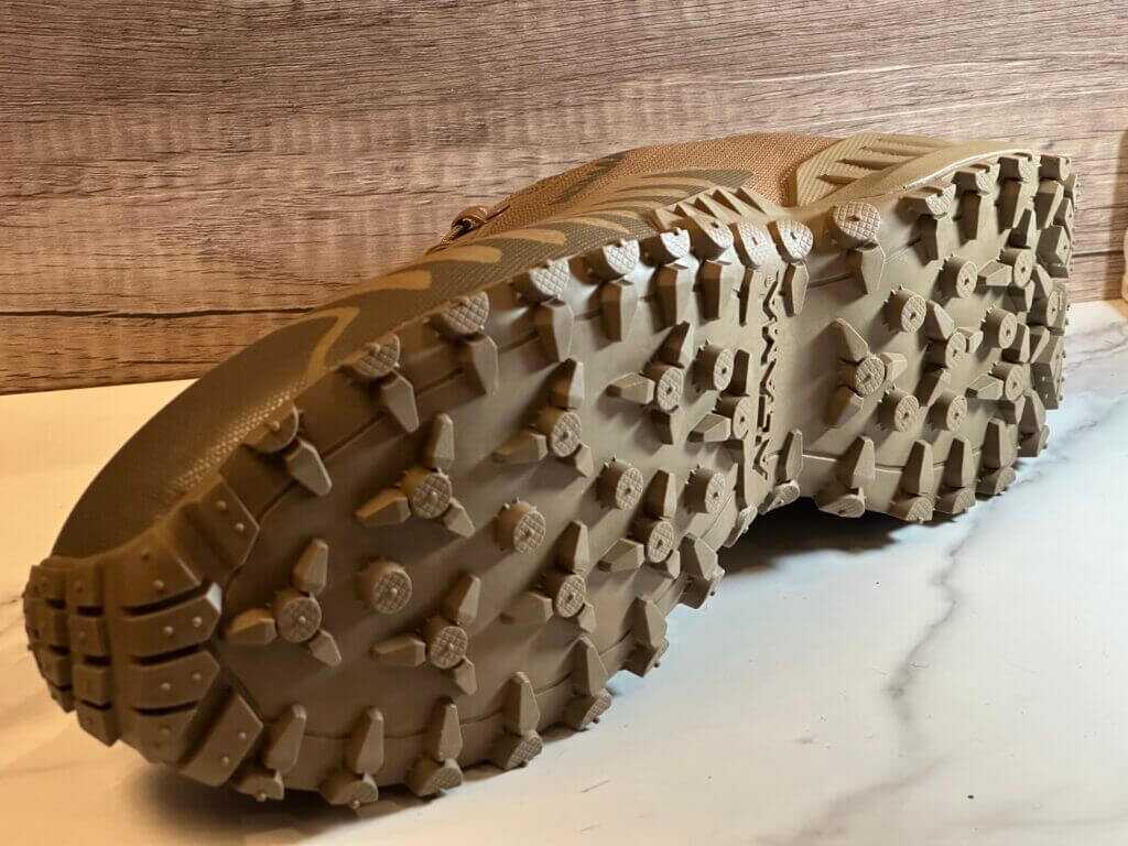 A shoe is turned on its side so the tread is facing outward.