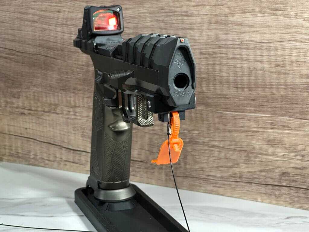 A pistol is pointed toward the viewer so we can see the bore clearly.