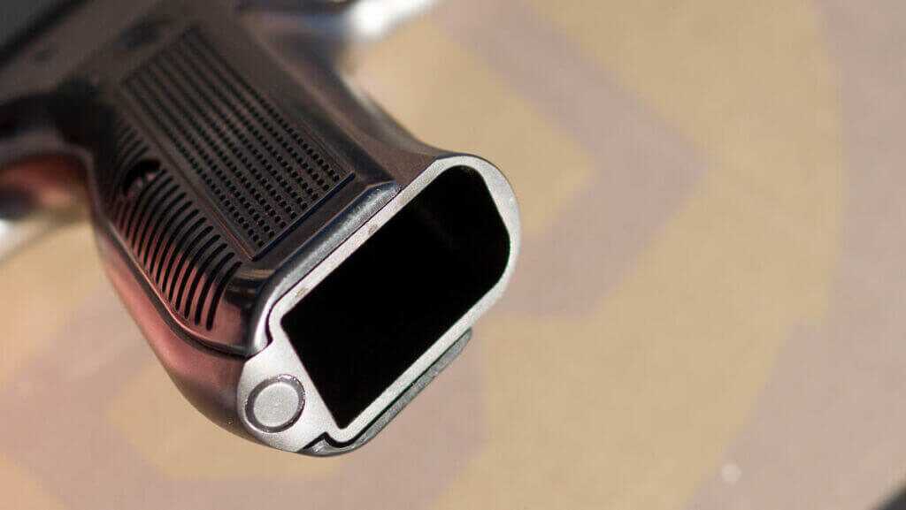 The bottom of the grip without a magazine.