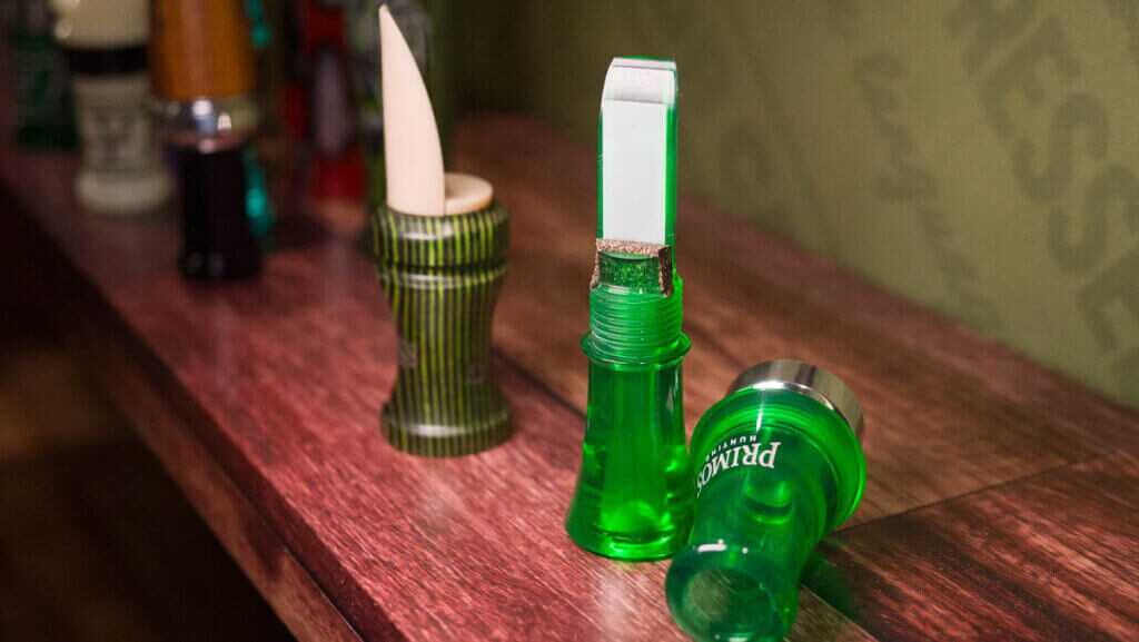 Close up view of a green call separated into two pieces showing the threaded connection.