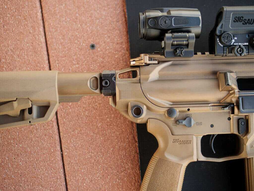 Close up of the stock joining the receiver on the right side of the gun.