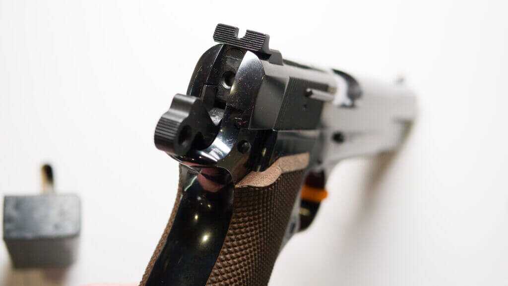 Close up view of the back of the slide with the hammer cocked.
