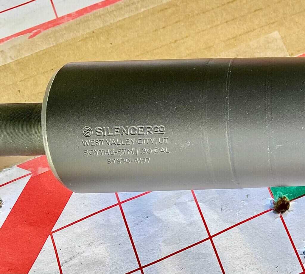 Stainless steel SilencerCo Scythe STM suppressor closeup showing full-auto rated construction