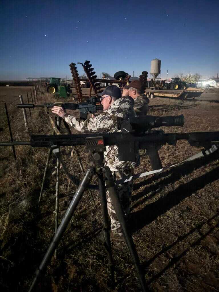 Brian McCombie and friend scanning hogs at night from a fenceline using Armasight Warden 640 thermal monocular