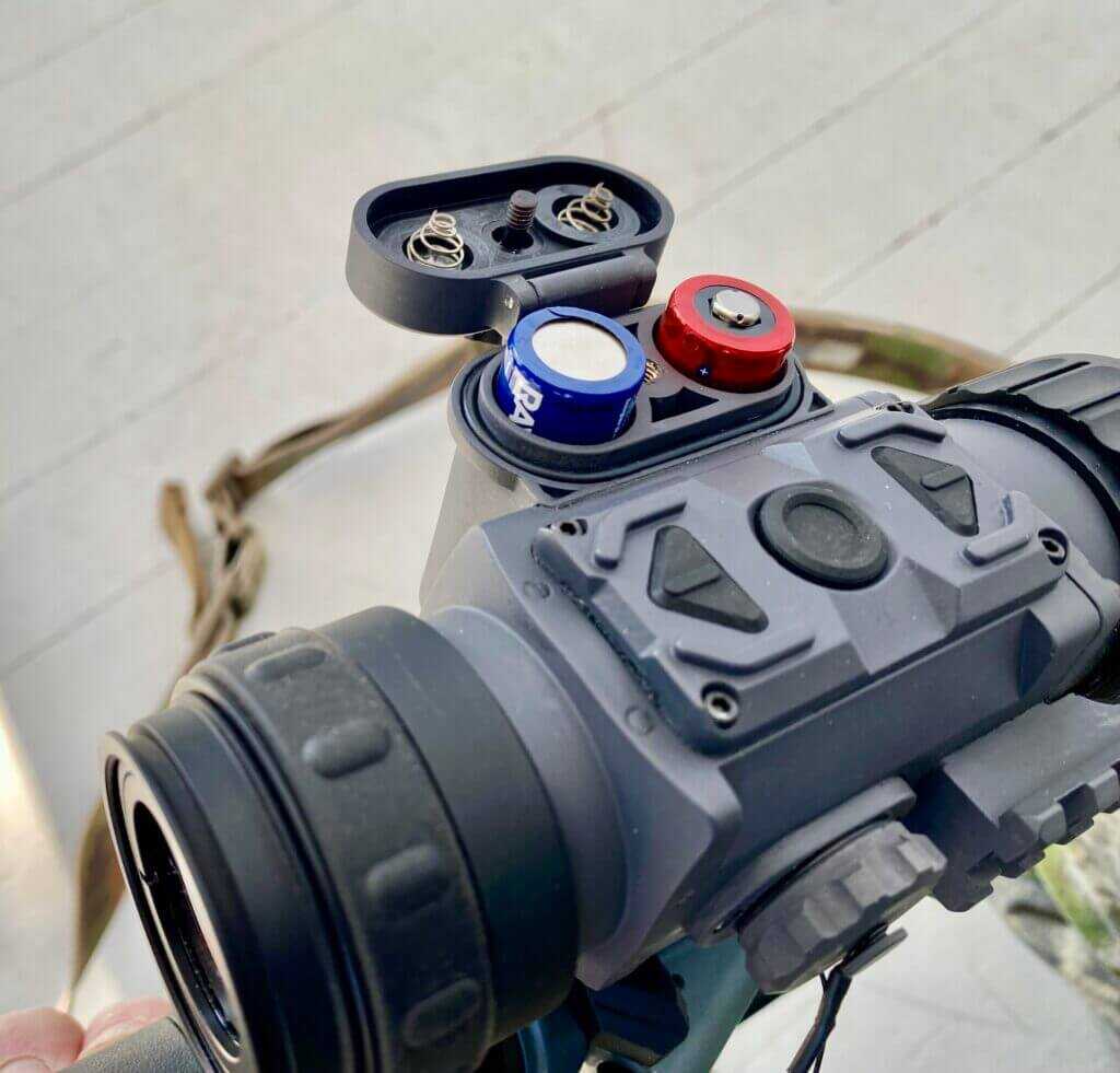 Armasight Commander 640 thermal scope controls and battery compartment detail showing three-button interface