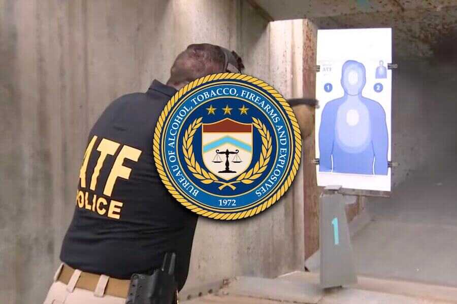 An ATF agent shooting at a indoor gun range.