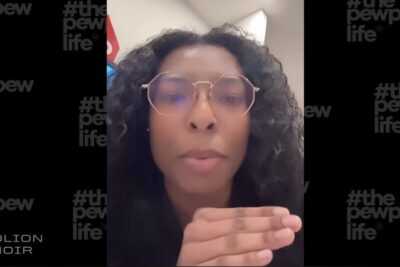 A woman pictured, discussing how difficult it is to buy a gun in a gun store.