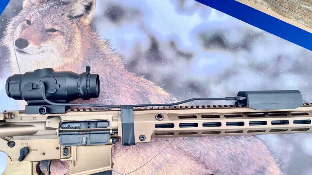 Sightmark external battery pack cable secured to rifle setup with electrical tape
