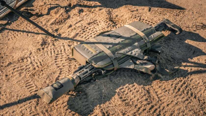 DRT Recon Lounger wrapped around a rifle showing carbon fiber rods protecting the trigger scope and receiver during transport