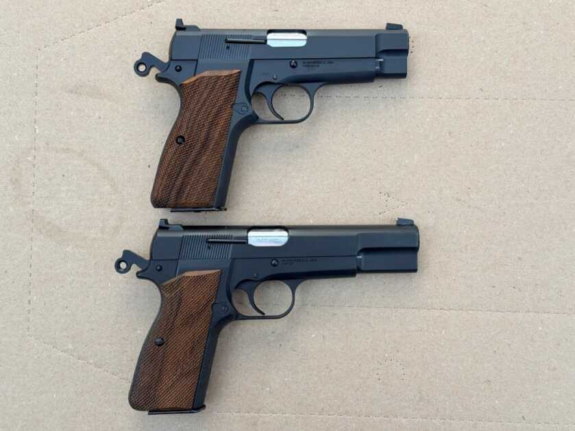 Springfield Armory SA-35 4-inch beside the author’s original customized full-size SA-35, highlighting compact slide length versus full-size Hi Power format