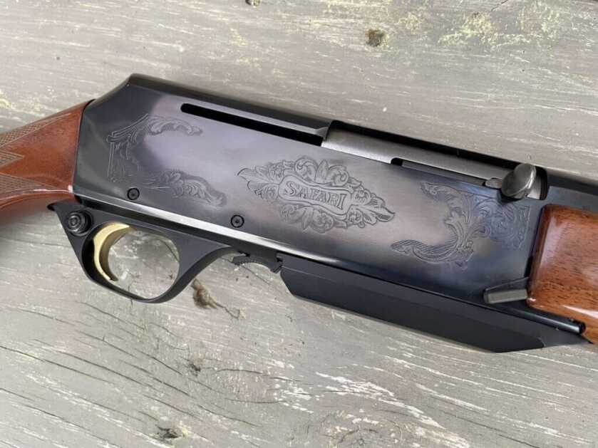 Engraved receiver on Browning BAR hunting rifle with polished blue finish