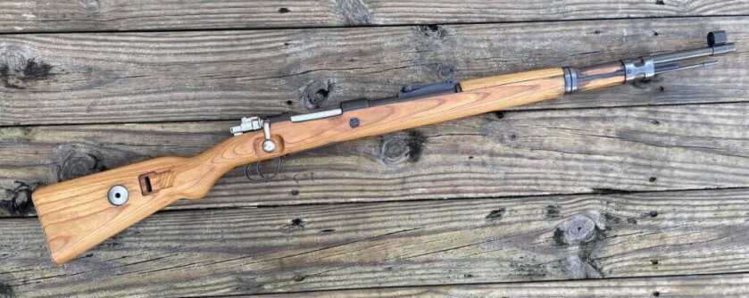 Mauser Karabiner 98k WWII bolt-action rifle profile on range bench
