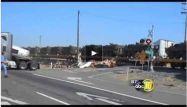 Proof: Martial Law Coming! - Military Vehicle Train Slams Semi The train is loaded with these mysterious troop carrier vehicles going... where?