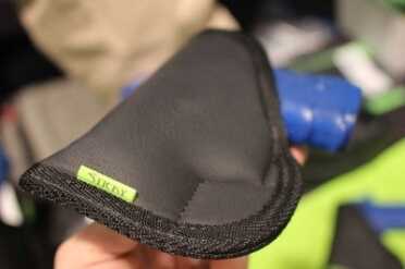 The fold adds a bit more bulk to the width of the gun, but helps obscure the shape.