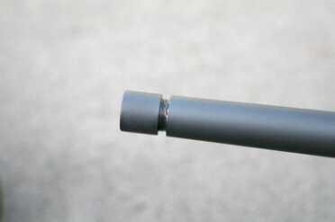 The muzzle is threaded for the use of a muzzle brake or sound suppressor.  This type of modification adds value as in years past a shooter would have to send the rifle to a gunsmith.