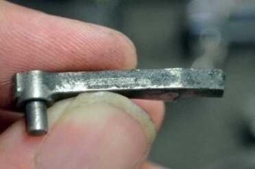 The back of the pawl.  Note where the plunger slides.