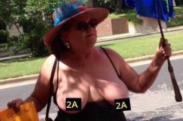 One of the topless pro-gun control supporters (Photo: Buzzpo)