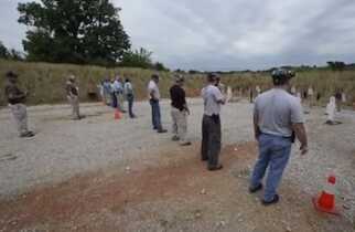 Trainees line up before their targets at the Shield Solutions range near West Planes, Missouri.  (Photo: Kansas City Star)