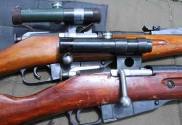 We bought two Mosin-Nagant snipers on GunsAmerica for this article. As you can see there are two versions of the excellent Russian PU scope, one black and one green. 