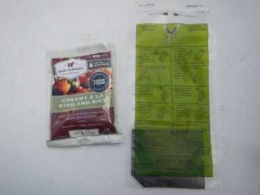 This is the Mealspec Ration Heater, in green, next to a 4 serving freeze dried rice dish from Wise foods. 