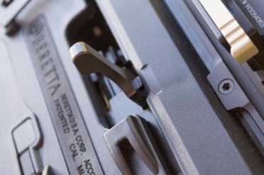 The bolt handle is smaller by necessity. I imagine aftermarket companies will offer enlarged covers that can be removed for maintenance.