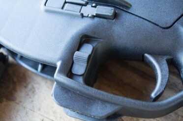 Levers on both sides of the trigger guard serve as bolt stop / bolt release controls.
