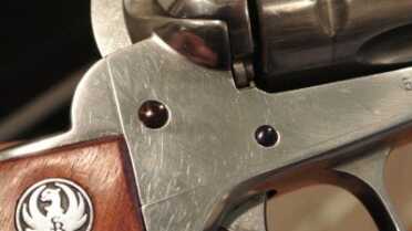 Pins installed on a Stainless Vaquero. My camera didn’t fully capture the blue/purple of the pins.