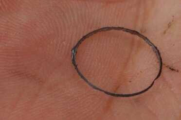 Forcing in the balls will shave off a ring of lead, which shows a tight fit.