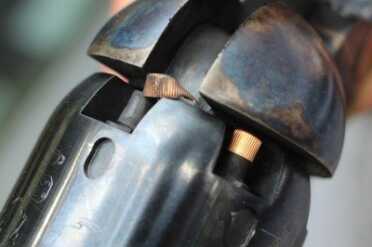 We did have a problem with caps popping off and getting caught in the tight spaces around the hammer.