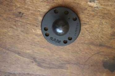 The base plate has holes for screws or bolts, and should be attached securely as all of the draw force will pull on these points.