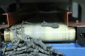 Next we went to the MIM department, for Metal Injection Molding.  These are hammers for the Heritage revolvers coming out of the machine.