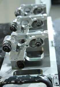 The Model 22s are built in threes, clamped to a carrier system. 