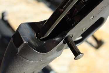 50 State Legal AR-15 - Ares Defense SCR The rod on the back of the bolt on the plunger/recoil spring in the stock.