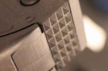 The texture on the back of the stock.