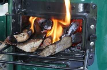 Prepping 101: Rocket Stove Cooking - The Fuel Miser After the chicken there was still this much fuel left, so I jammed it in and closed the fuel door to see how long it would burn. It kept the water pot boiling more than a half hour longer.
