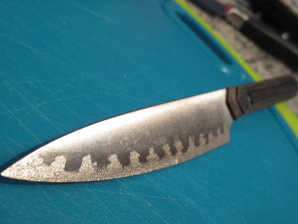A shot of the badass titanium paring knife, note the cool stippling design on the blade.  