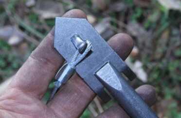 An 18" long tool hooks onto the anchor and you hammer it into the ground. 