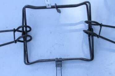 Eventually I got it and did both sides. Once the clips are clipped, the trap is fairly stable and can be transported into the field, read to be set. 