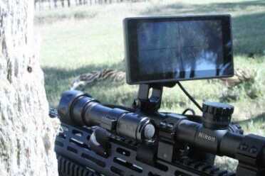 During the day you also look at the screen, which means you can shoot around cover without having to put your head behind the gun. 